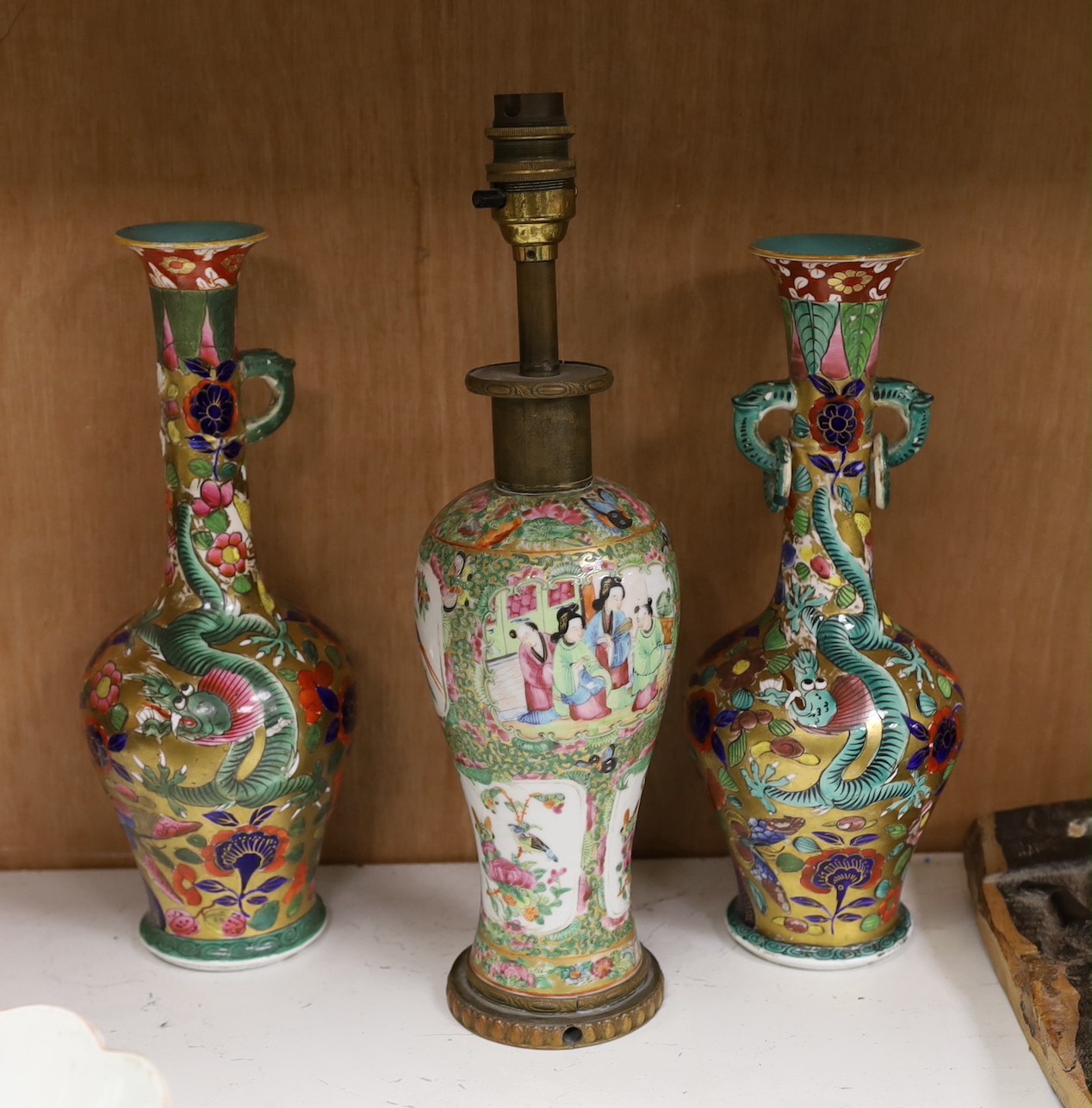 A Chinese overlaid glass snuff bottle, together with a Chinese famille rose vase converted into a lamp, together with, a fish brush holder, a Japanese painted ceramic duck, and other items, tallest 29cm
